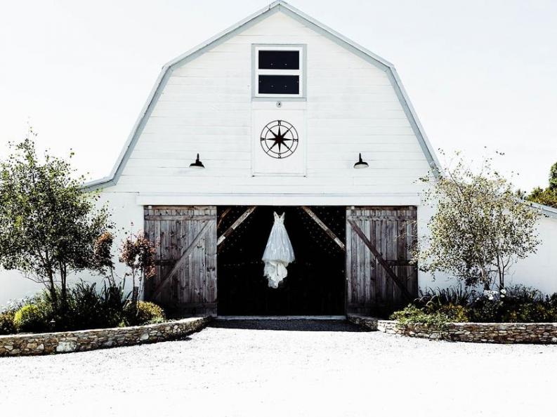 Brides-Dress-Hanging-Entrance-Overlook-Barn