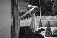 Brides-Dress-Hanging-Overlook-Barn