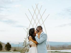 Ceremony-Platform-Kiss-With-Arch-Decor