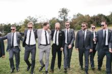 Groomsmen-Walking-In-Meadow-MW