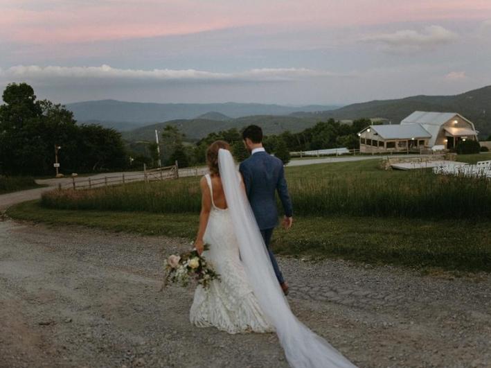 Wedding-Couple-Walk-Down-Overlook-Property-Road
