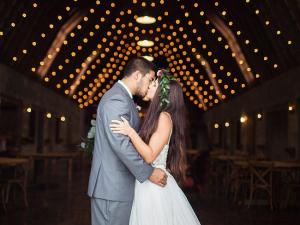 Wedding-Couple-Kiss-Under-String-Lights