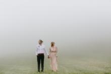 Bride-Groom-Walking-in-Meadow 